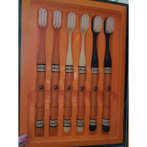 Brush With Style With These Unisex Toothbrushs - Orange & Black